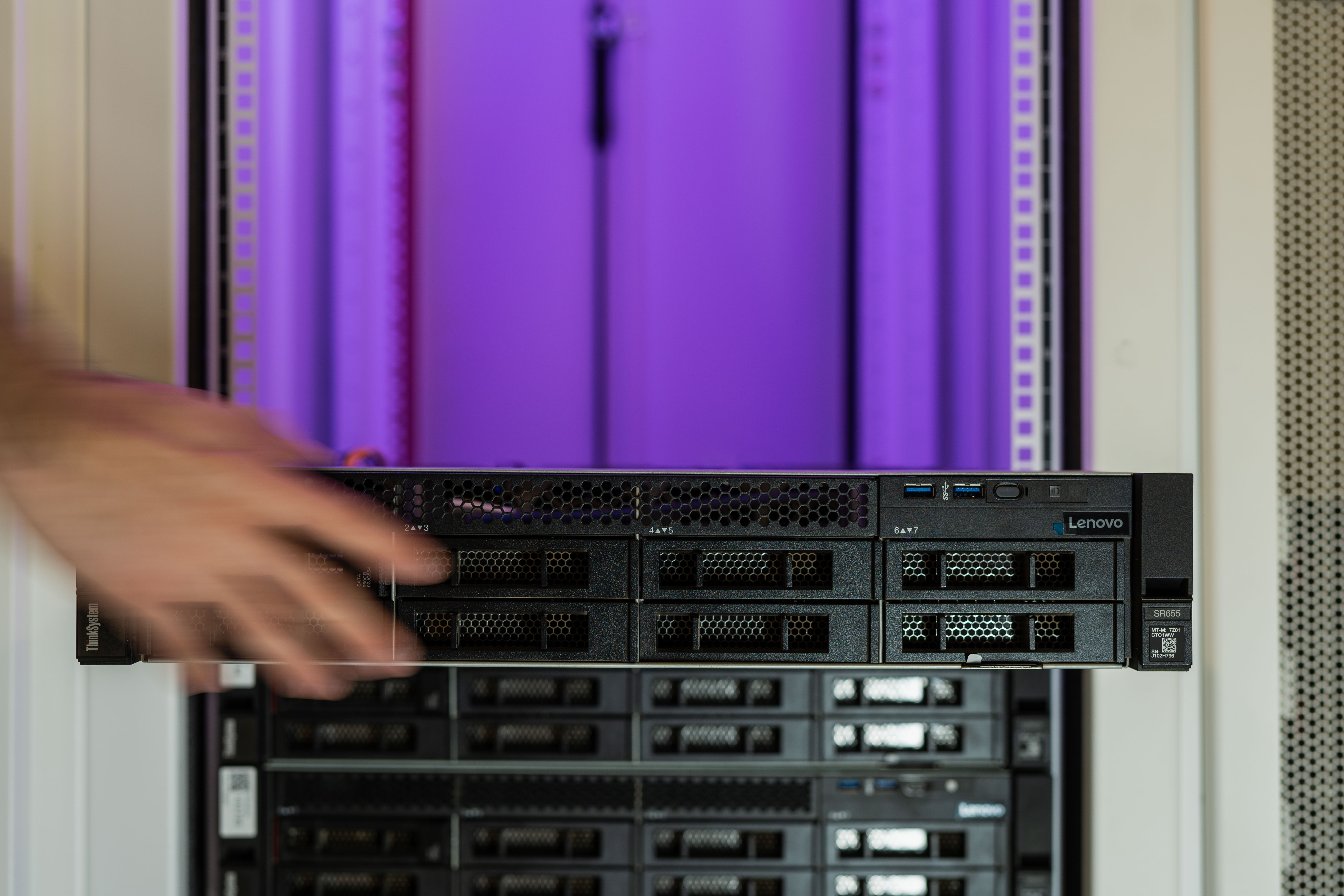 Technician walking the data center floor